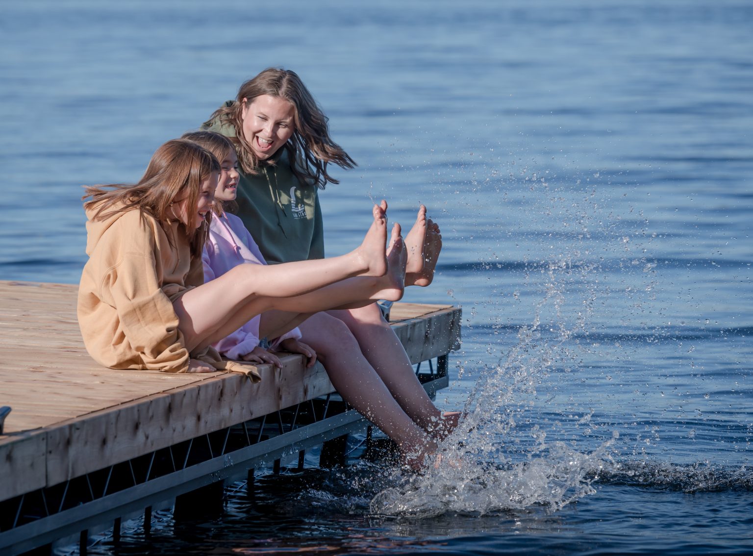 Children playing dock water splashing photo